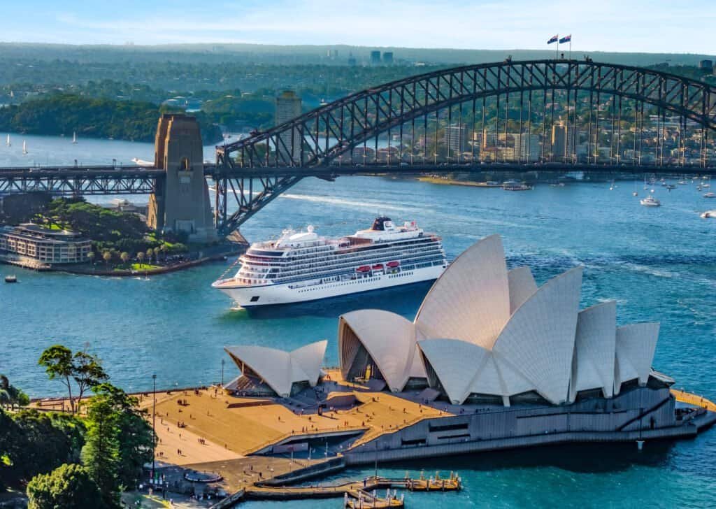 Iconic Sydney Opera House and Harbour Bridge with cruise ship in Sydney Harbour, Australia, perfect.