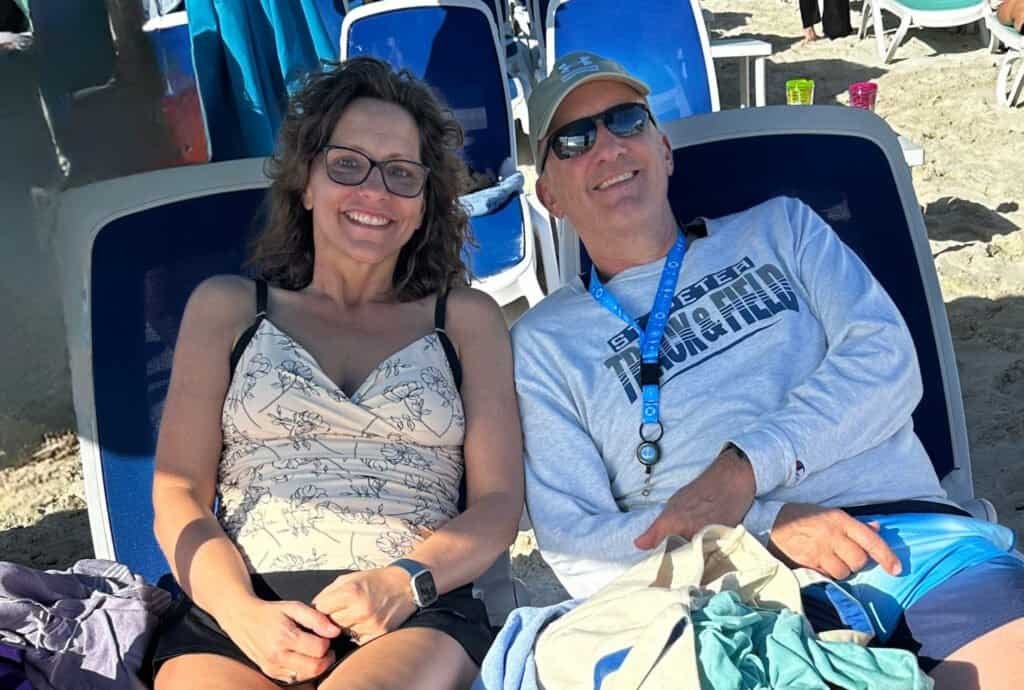 Relaxing beach day with travelers enjoying sunny weather and ocean views.